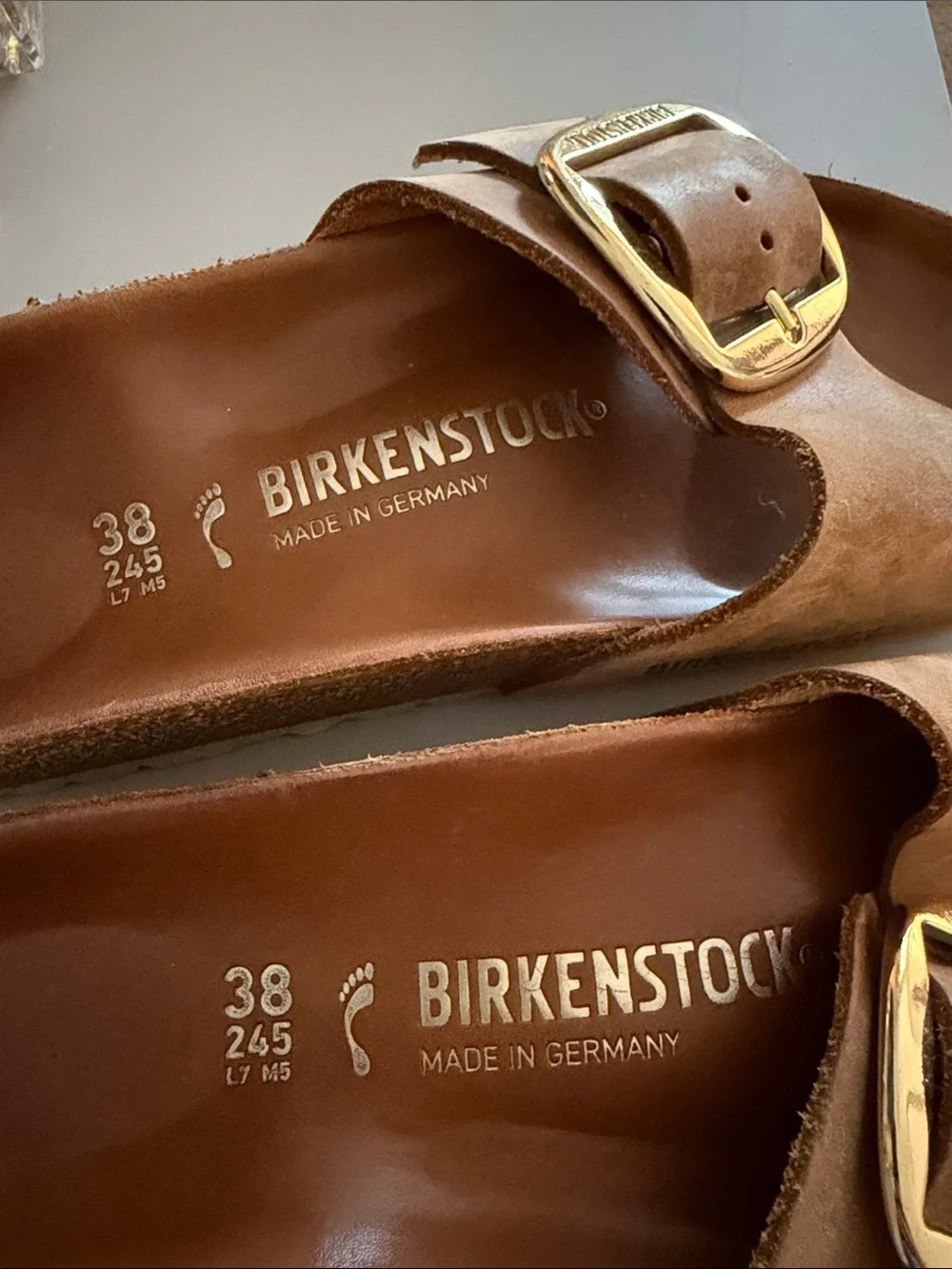 Birkenstock Tan Slide Sandals with Gold Buckles
